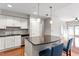 Well-lit kitchen features stainless appliances, tile backsplash, and a breakfast bar at 222 Glenwood Ave # 508, Raleigh, NC 27603