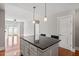 Bright open-concept kitchen and living area, with island seating and hardwood flooring at 222 Glenwood Ave # 508, Raleigh, NC 27603