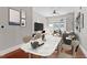 Bright living room with gray walls, dining area and balcony access at 222 Glenwood Ave # 508, Raleigh, NC 27603