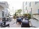 Outdoor area with tables, seating, a grill, and a fireplace that make a great condo common area at 222 Glenwood Ave # 508, Raleigh, NC 27603
