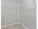 Walk-in closet featuring wire shelving and neutral carpet at 222 Glenwood Ave # 508, Raleigh, NC 27603