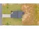 Aerial view of a house with a gray roof, a long driveway, and a well-maintained lawn at 35 Diamond Creek Dr, Zebulon, NC 27597