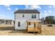 Rear exterior view of a home with a porch and white siding at 35 Diamond Creek Dr, Zebulon, NC 27597