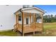 New back porch features stained wood stairs and railing at 35 Diamond Creek Dr, Zebulon, NC 27597