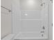 Bright white bathtub with shower head and chrome fixtures at 35 Diamond Creek Dr, Zebulon, NC 27597