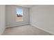 Bright bedroom features a window with a view and neutral carpeting at 35 Diamond Creek Dr, Zebulon, NC 27597