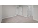 Bedroom features neutral paint, carpeted floor, and two entryways, one to a closet, another to a hallway at 35 Diamond Creek Dr, Zebulon, NC 27597