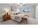 Bright bedroom featuring neutral tones, a large window, and plush carpeting for a serene retreat at 35 Diamond Creek Dr, Zebulon, NC 27597