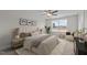 Well-lit bedroom with a comfortable bed, soft carpet, neutral tones, and a view of the outdoors at 35 Diamond Creek Dr, Zebulon, NC 27597