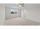 Bright bedroom features a window with views and neutral carpeting at 35 Diamond Creek Dr, Zebulon, NC 27597