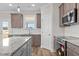 Modern kitchen features granite countertops, stainless steel appliances, and lots of natural light at 35 Diamond Creek Dr, Zebulon, NC 27597