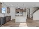 Modern kitchen features granite countertops, stainless steel appliances, and a spacious island perfect for entertaining at 35 Diamond Creek Dr, Zebulon, NC 27597