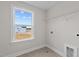 Laundry room with a window and tile floors at 35 Diamond Creek Dr, Zebulon, NC 27597