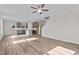 Open concept living space with a modern kitchen and wood plank flooring, perfect for entertaining at 35 Diamond Creek Dr, Zebulon, NC 27597