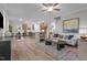 Open-concept living room flows into a kitchen with stainless steel appliances and light-filled dining area at 35 Diamond Creek Dr, Zebulon, NC 27597