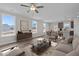 Bright living room featuring lots of natural light, wood flooring, and seamless access to the kitchen and dining area at 35 Diamond Creek Dr, Zebulon, NC 27597