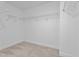 Empty walk-in closet with carpeted floors and wire shelving, ready for organizing your wardrobe at 35 Diamond Creek Dr, Zebulon, NC 27597
