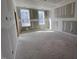 Spacious bedroom showing unfinished drywall and large windows for ample natural light at 9148 Dupree Meadow Dr # 11, Angier, NC 27501