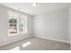Neutral bedroom with carpet and double-hung window at 9148 Dupree Meadow Dr # 11, Angier, NC 27501
