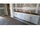 Cabinets featuring white doors and drawers, enhancing the kitchen's storage at 9148 Dupree Meadow Dr # 11, Angier, NC 27501
