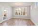 Well-lit dining area featuring a chandelier and large windows with backyard view at 9148 Dupree Meadow Dr # 11, Angier, NC 27501