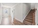 Welcoming entryway with hardwood floors, stairs, and white door at 9148 Dupree Meadow Dr # 11, Angier, NC 27501