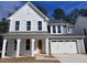 Beautiful two-story home with vertical siding, gray accents and a two car garage at 9148 Dupree Meadow Dr # 11, Angier, NC 27501