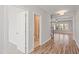 Hallway with wood floors leading to bathroom and living room at 9148 Dupree Meadow Dr # 11, Angier, NC 27501