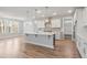 Open kitchen design with a central island and sleek pendant lighting at 9148 Dupree Meadow Dr # 11, Angier, NC 27501