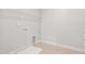 Laundry room with utility sink, hanging rack, and tile floor at 9148 Dupree Meadow Dr # 11, Angier, NC 27501