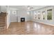 Open living room with fireplace and large windows at 9148 Dupree Meadow Dr # 11, Angier, NC 27501