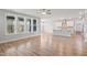 Open-concept living room connecting to the kitchen with island and stainless appliances at 9148 Dupree Meadow Dr # 11, Angier, NC 27501