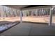 View of covered patio overlooking a spacious yard with trees in the background at 9148 Dupree Meadow Dr # 11, Angier, NC 27501
