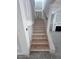 Interior shot of a wooden stairway with white risers and a matching handrail at 9148 Dupree Meadow Dr # 11, Angier, NC 27501