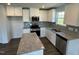 Modern kitchen with stainless steel appliances, granite countertops, and shaker cabinets at 111 Johnson Ridge Way, Four Oaks, NC 27524