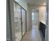 Modern bathroom showcasing a glass-enclosed shower leading to a double vanity and spacious walk-in closet at 259 Johnson Ridge Way, Four Oaks, NC 27524