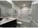 Bathroom with vanity, shower/tub combo, tile floors, and easy access to the toilet at 259 Johnson Ridge Way, Four Oaks, NC 27524