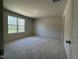 Spacious bedroom bathed in natural light, featuring plush carpeting and a serene, inviting atmosphere at 259 Johnson Ridge Way, Four Oaks, NC 27524