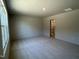 Expansive bedroom with large window and carpet, leading into an ensuite bathroom with walk-in shower at 259 Johnson Ridge Way, Four Oaks, NC 27524