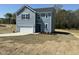 Charming two-story home with a garage and fresh sod in the front yard at 259 Johnson Ridge Way, Four Oaks, NC 27524