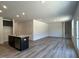 Open-concept living room featuring modern floors, recessed lighting, and kitchen island with stainless steel dishwasher at 259 Johnson Ridge Way, Four Oaks, NC 27524