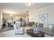 Bright open-concept living space features a harmonious blend of living and dining areas with stylish decor at 259 Johnson Ridge Way, Four Oaks, NC 27524