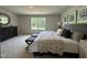 Main bedroom offers a large window, stylish decor, and lots of space for furniture at 259 Johnson Ridge Way, Four Oaks, NC 27524