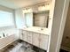 Elegant bathroom featuring a double sink vanity, sleek hardware, and a separate tub for relaxation at 320 Bishop Ln, Sanford, NC 27330