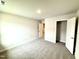 Spacious bedroom with neutral walls, plush carpeting, and walk-in closet at 320 Bishop Ln, Sanford, NC 27330