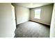 Cozy bedroom featuring a window bringing in natural light and neutral-toned walls at 320 Bishop Ln, Sanford, NC 27330