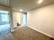 Spacious bonus room with plush carpeting and access to other rooms at 320 Bishop Ln, Sanford, NC 27330