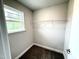 Walk-in closet features wire shelving and a window for natural light at 320 Bishop Ln, Sanford, NC 27330