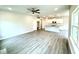 Open-concept living space featuring hardwood floors, recessed lighting and view of kitchen island at 320 Bishop Ln, Sanford, NC 27330
