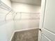 Bright walk-in closet with ample shelving, providing efficient storage and organization solutions at 320 Bishop Ln, Sanford, NC 27330